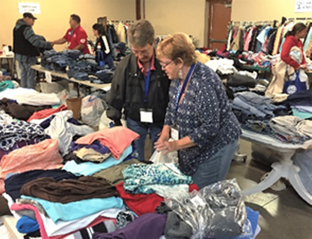 Tables full of donated clothing for homeless and at-risk veterans.