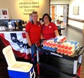 Two American Legion Auxiliary Unit 132 members with cupcakes and supplies for the Arizona State Veterans Home in Tucson.