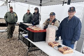 Members of American Legion Post 132 and Border Patrol Members staffing Burger Burn serving line.