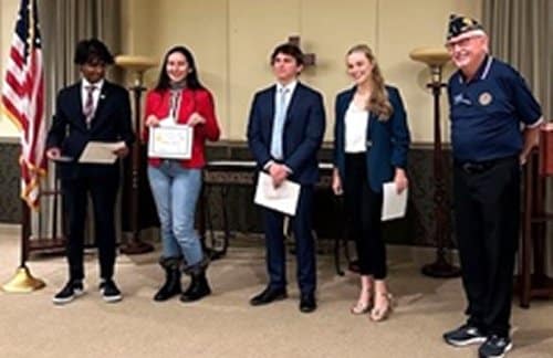 Oratorical competitors standing with sponsoring representatives.