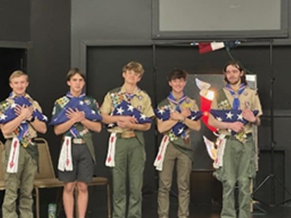 Five Scouts at their Eagle rank award presentation.