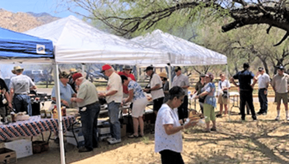 Post Annual BBQ folks lined up in serving line.